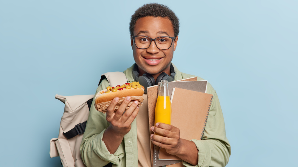 student holding food